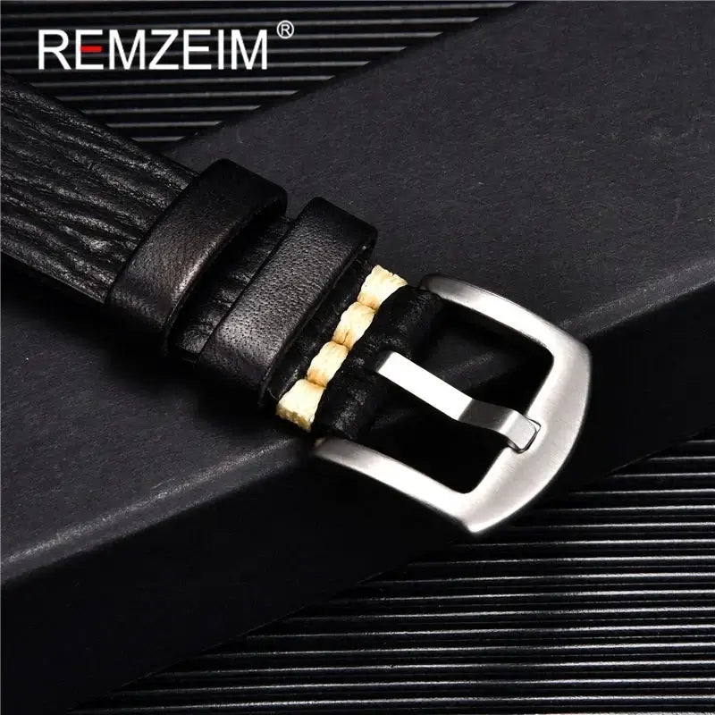Close-up of a textured black leather Suunto watch band featuring a silver buckle, perfect for stylish wear.