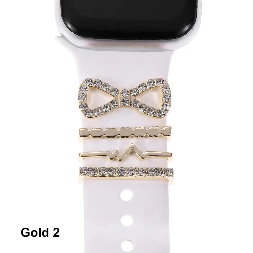 Decorative gold metal charms for Apple Watch bands, featuring a bow and stylish accents for a chic look.