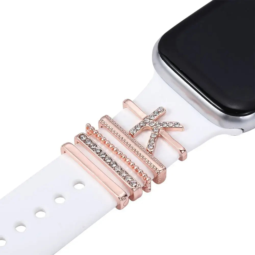 Decorative rose gold charm on white Apple Watch band, adding elegance and style to your smartwatch.