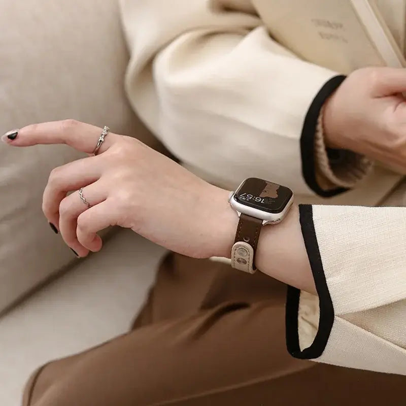 Stylish woman wearing a Thin Leather Apple Watch Band, showcasing elegance and quality in smartwatch accessories.