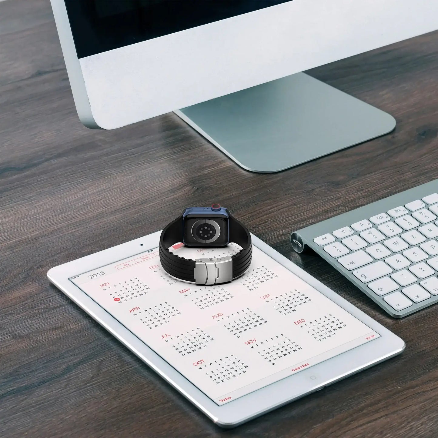 Silicone Apple Watch band with metal buckle displayed on an iPad and desktop, blending style and functionality.