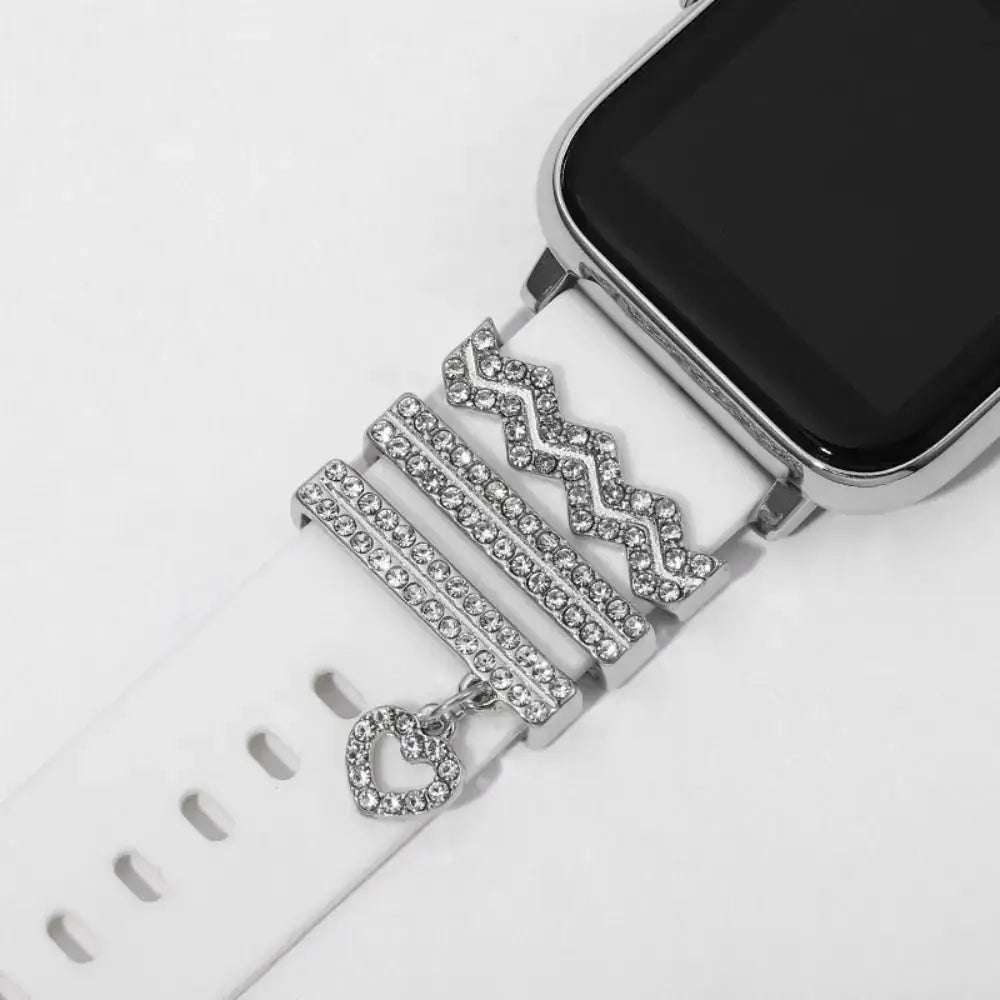 Decorative metal charms on a white Apple Watch band, showcasing elegance and sophistication for stylish wearables.