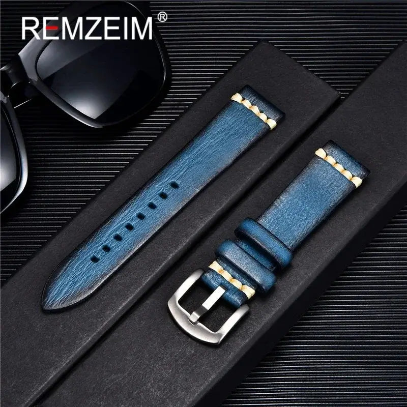 Blue leather watch band from REMZEIM, featuring stylish design and durable materials, shown with sunglasses.