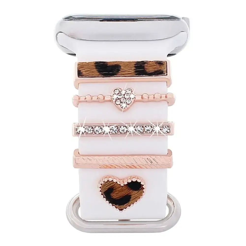 Decorative metal charms for Apple Watch bands, featuring chic designs in rose gold and leopard print.