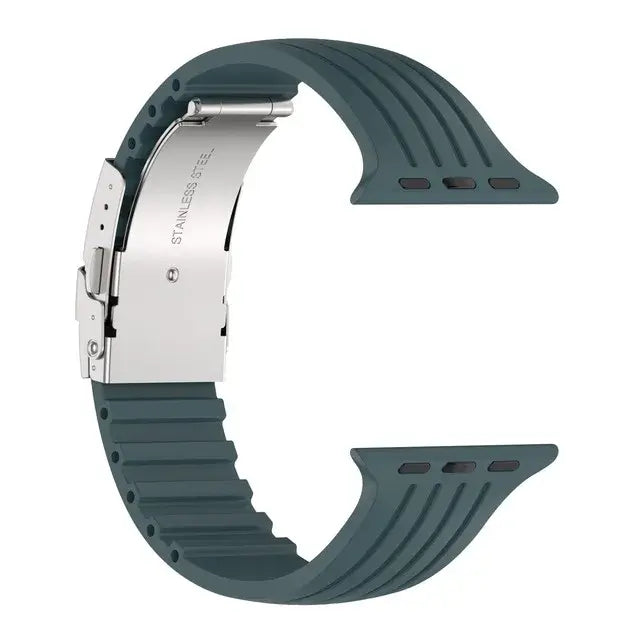 Silicone Apple Watch band in dark teal with stainless steel buckle, combining style, comfort, and durability for any occasion.