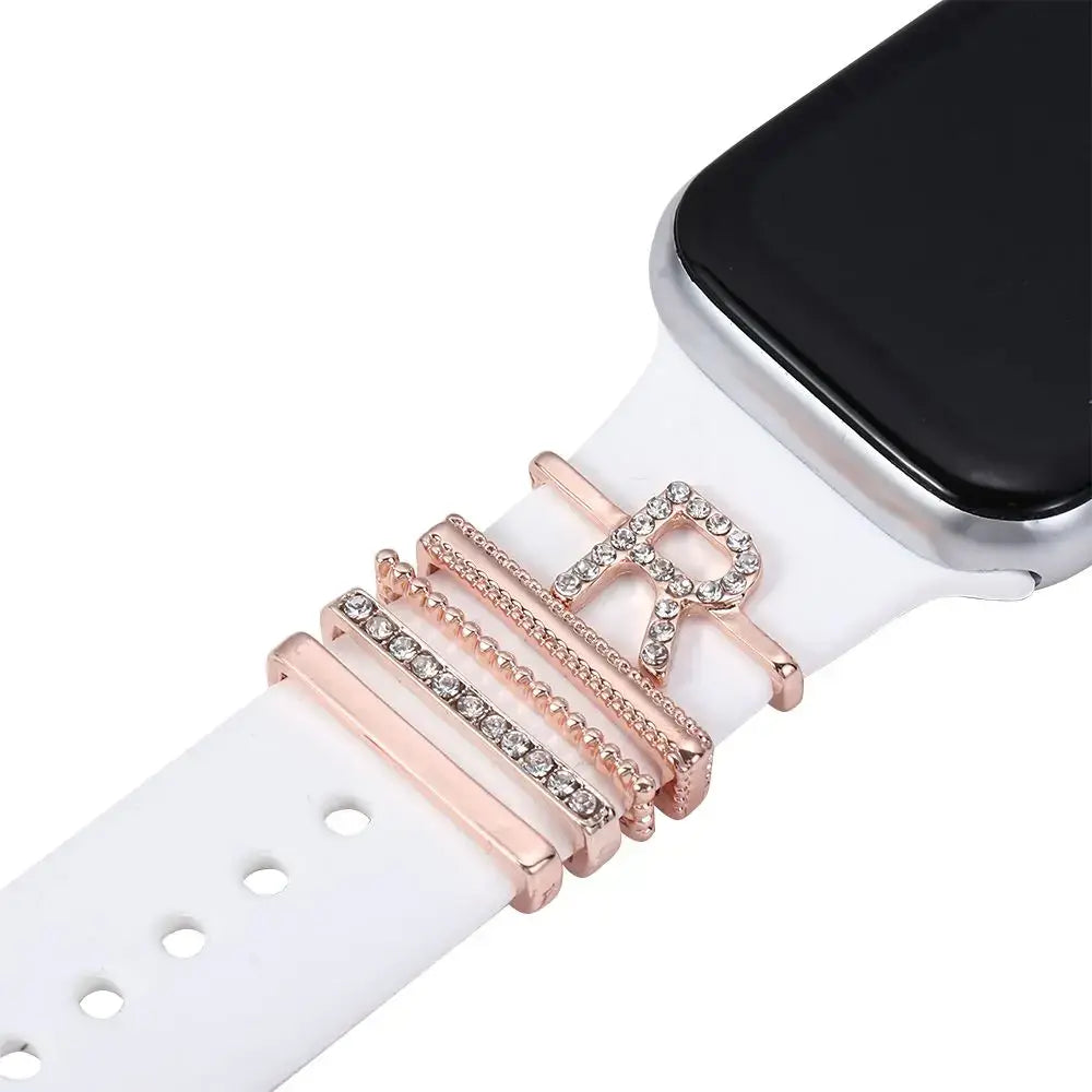 Decorative metal charms with crystals for Apple Watch bands in rose gold and white, adding sophistication to your smartwatch.