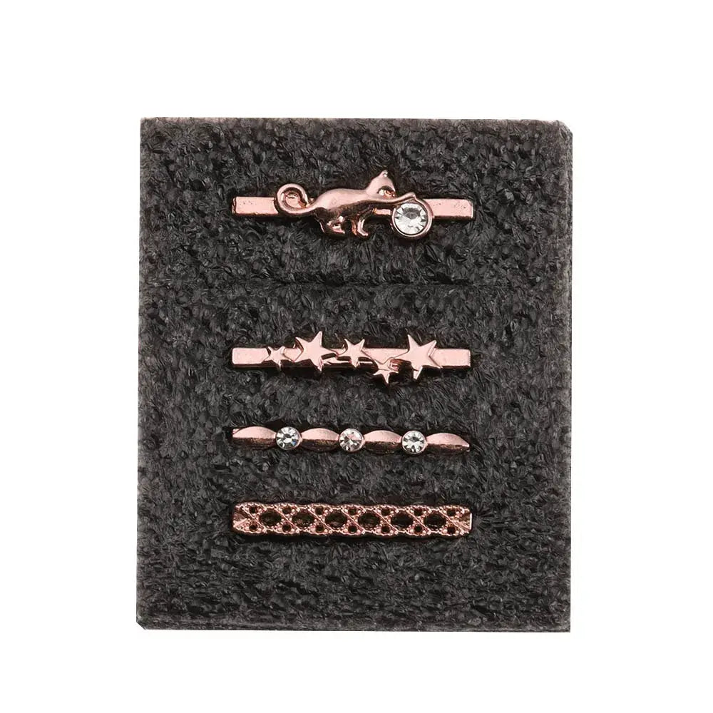 Decorative metal charms for Apple Watch bands featuring a cat, stars, and rhinestones in rose gold finish.
