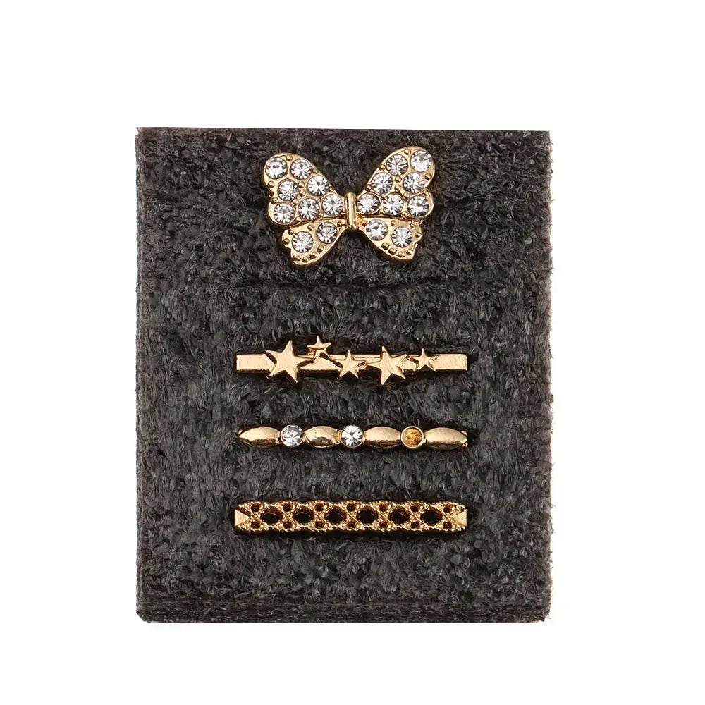 Decorative metal charms for Apple Watch, including a rhinestone bow and star designs, adding style and personalization.