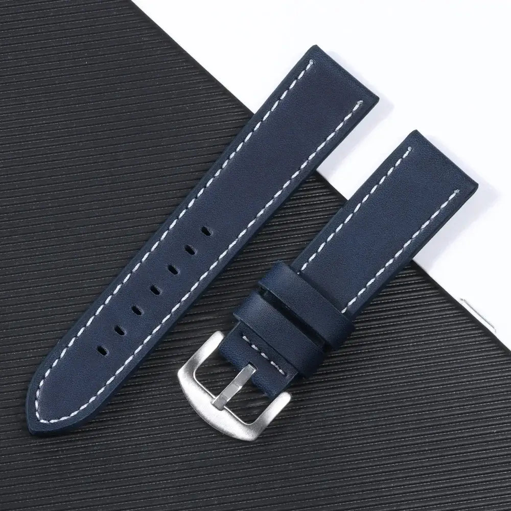 Navy leather Suunto watch band with silver buckle, showcasing sleek design and durability for smartwatches.
