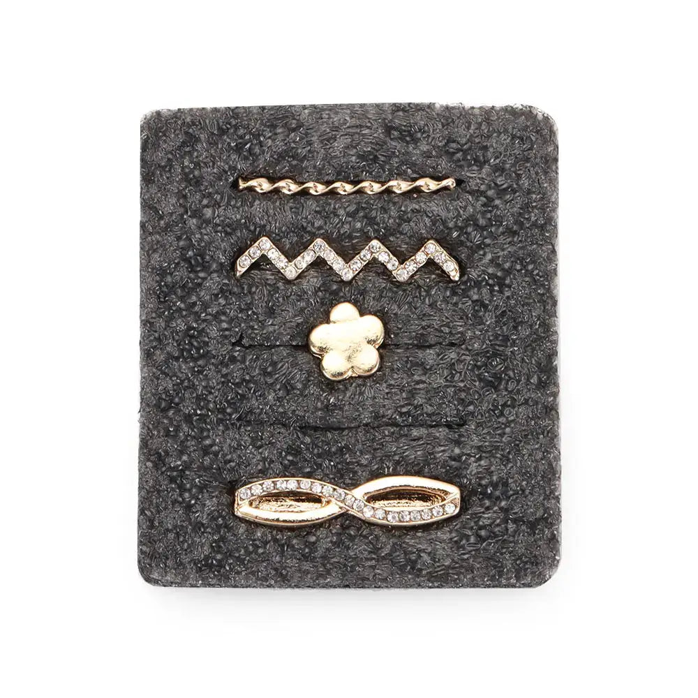 Decorative metal charms in gold featuring unique designs to personalize Apple Watch bands.