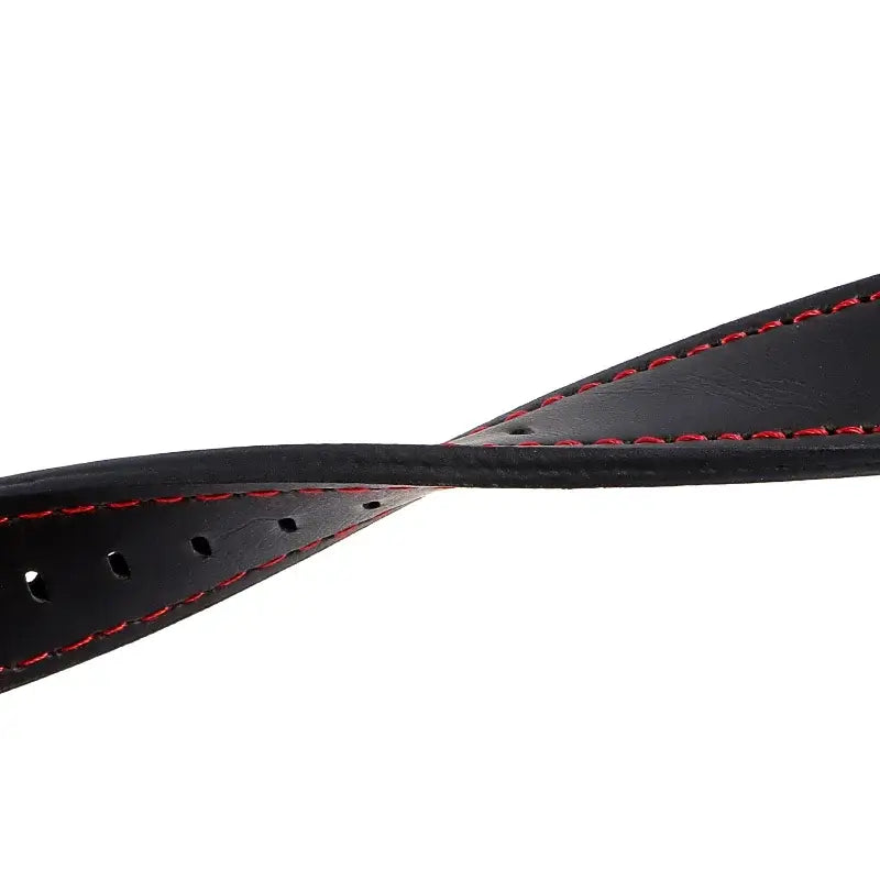 Close-up of a stylish black leather Suunto watch band with red stitching, showcasing its modern design and durability.