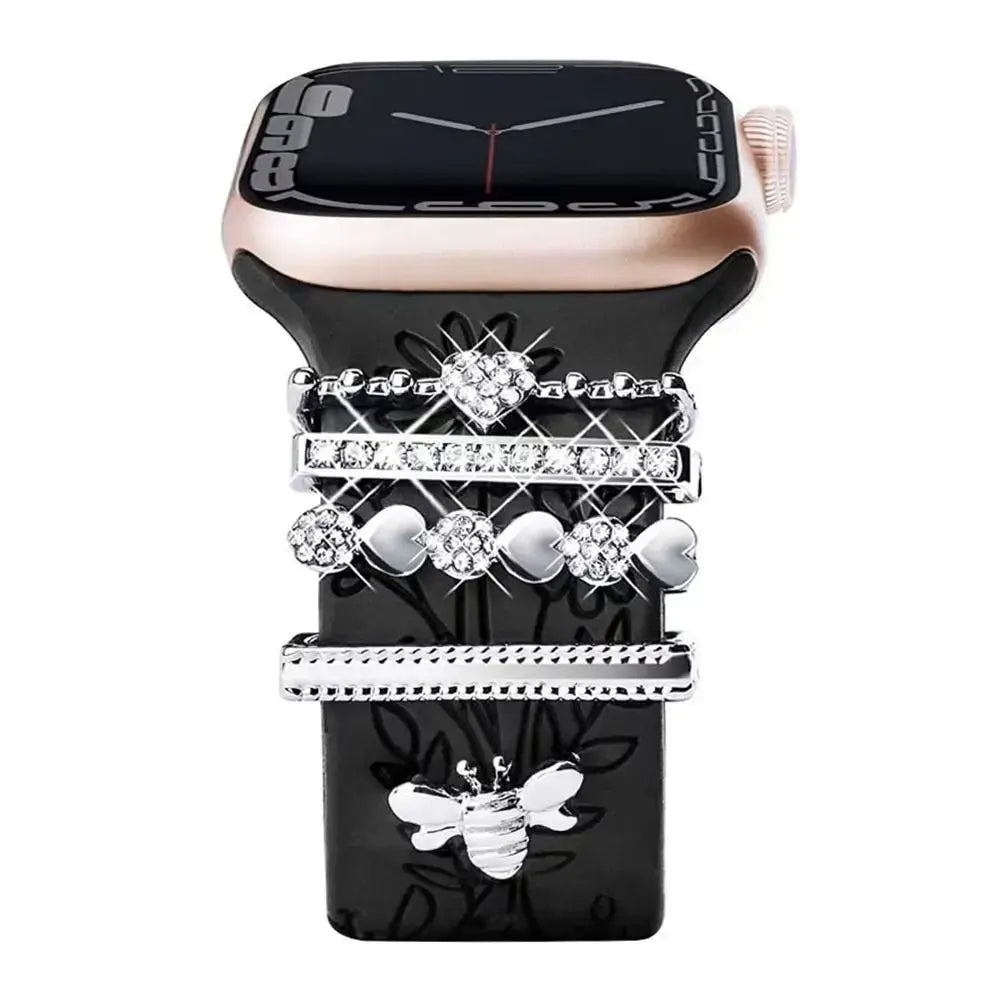 Decorative metal charms on black Apple Watch band, featuring elegant design and high-quality craftsmanship.