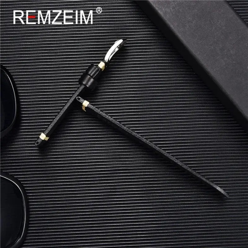 Stylish black REMZEIM sunglasses with a sleek, textured strap on a dark background, perfect for fashion-forward individuals.