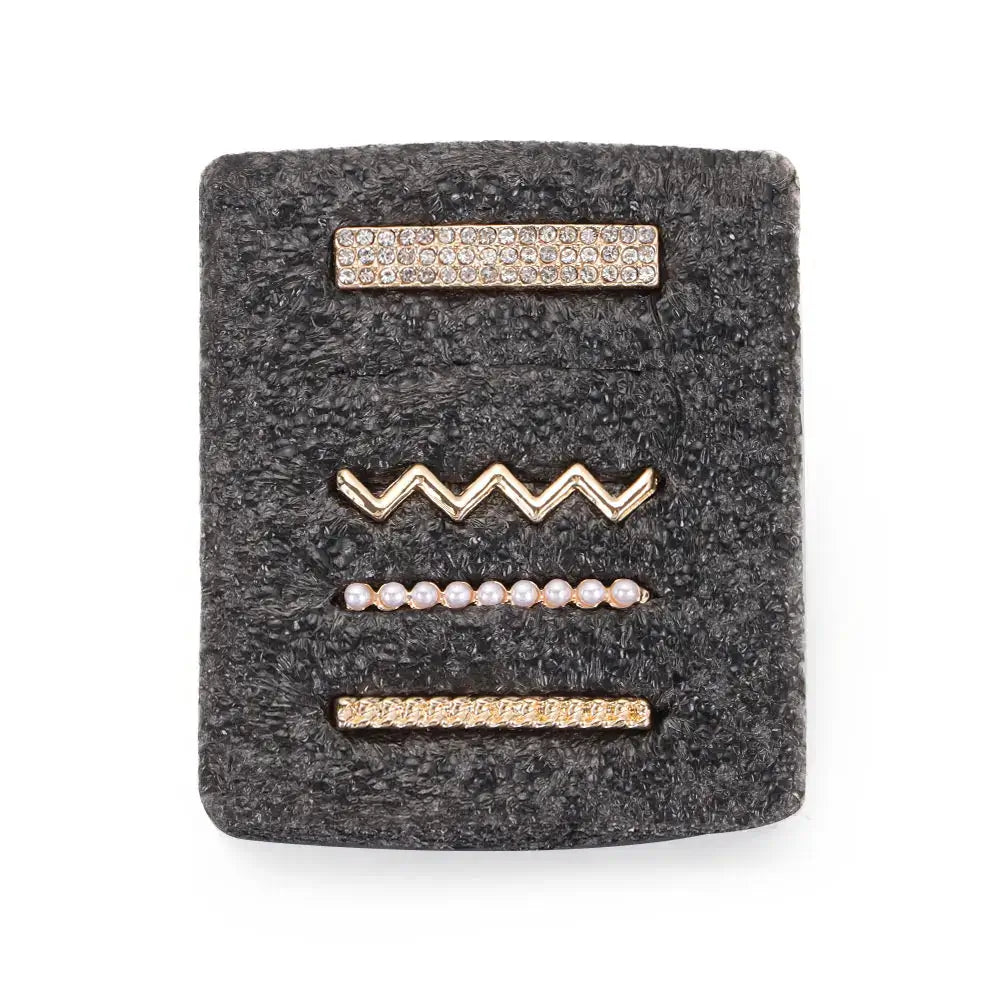 Set of decorative metal charms for Apple Watch bands in gold styles, including rhinestones and pearls on a gray background.