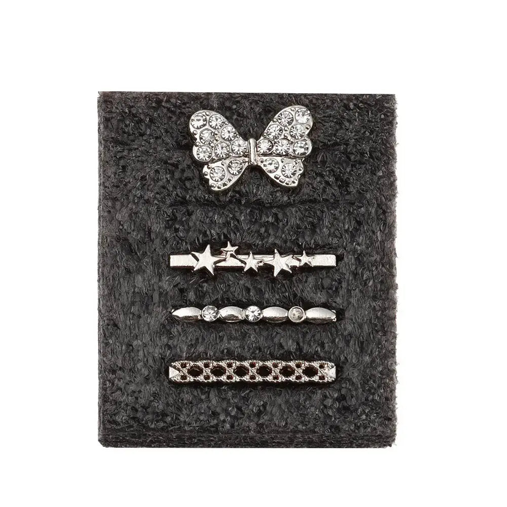 Set of four decorative metal charms for Apple Watch bands, featuring a bow, stars, and stylish designs.