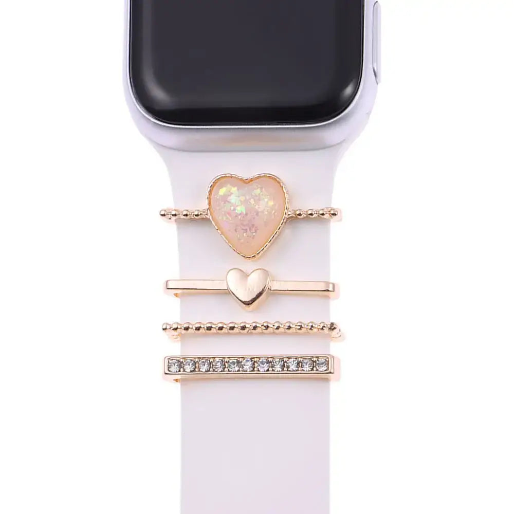 Decorative metal charms for Apple Watch bands featuring heart and crystal designs for stylish smartwatch enhancement.