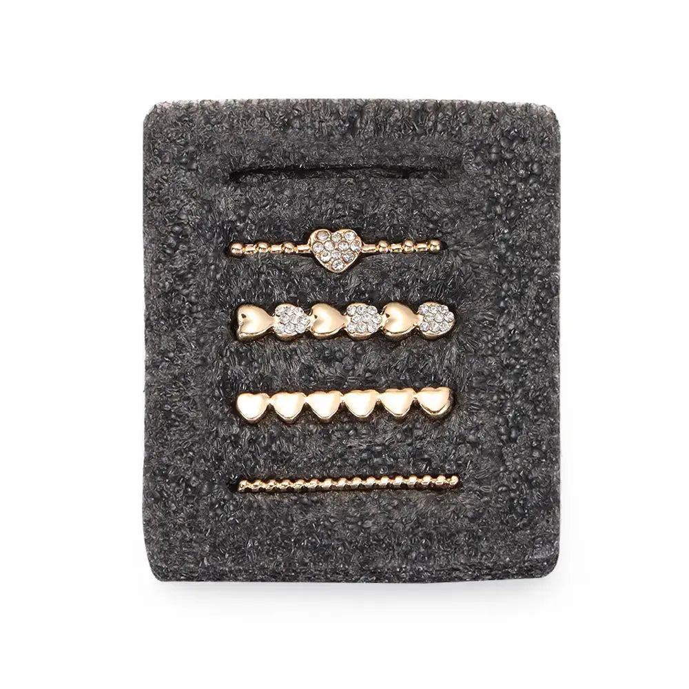 Decorative gold heart-shaped charms for Apple Watch bands, adding style and personalization. Perfect for customization.