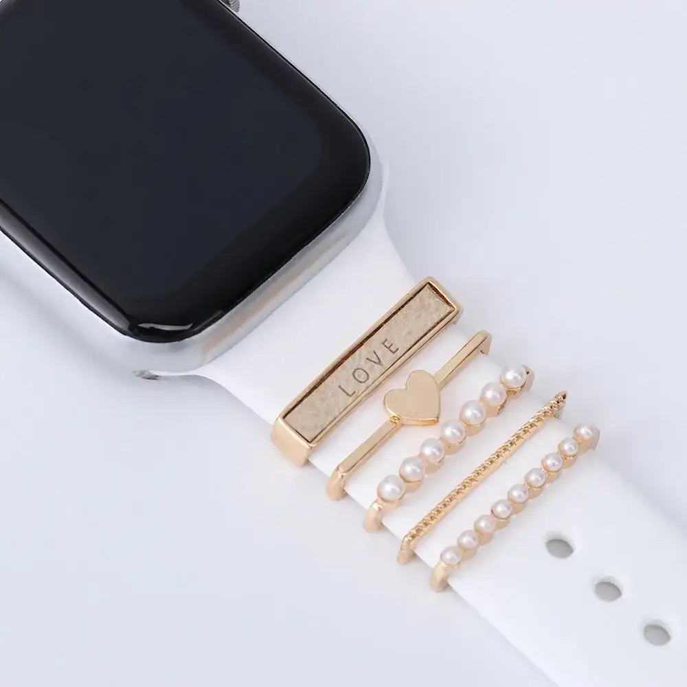 Decorative metal charms for Apple Watch bands, featuring 'LOVE' and pearl accents, enhancing smartwatch style and elegance.