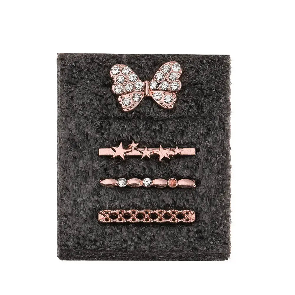 Decorative metal charms for Apple Watch bands featuring a rhinestone butterfly and star designs on a black background.