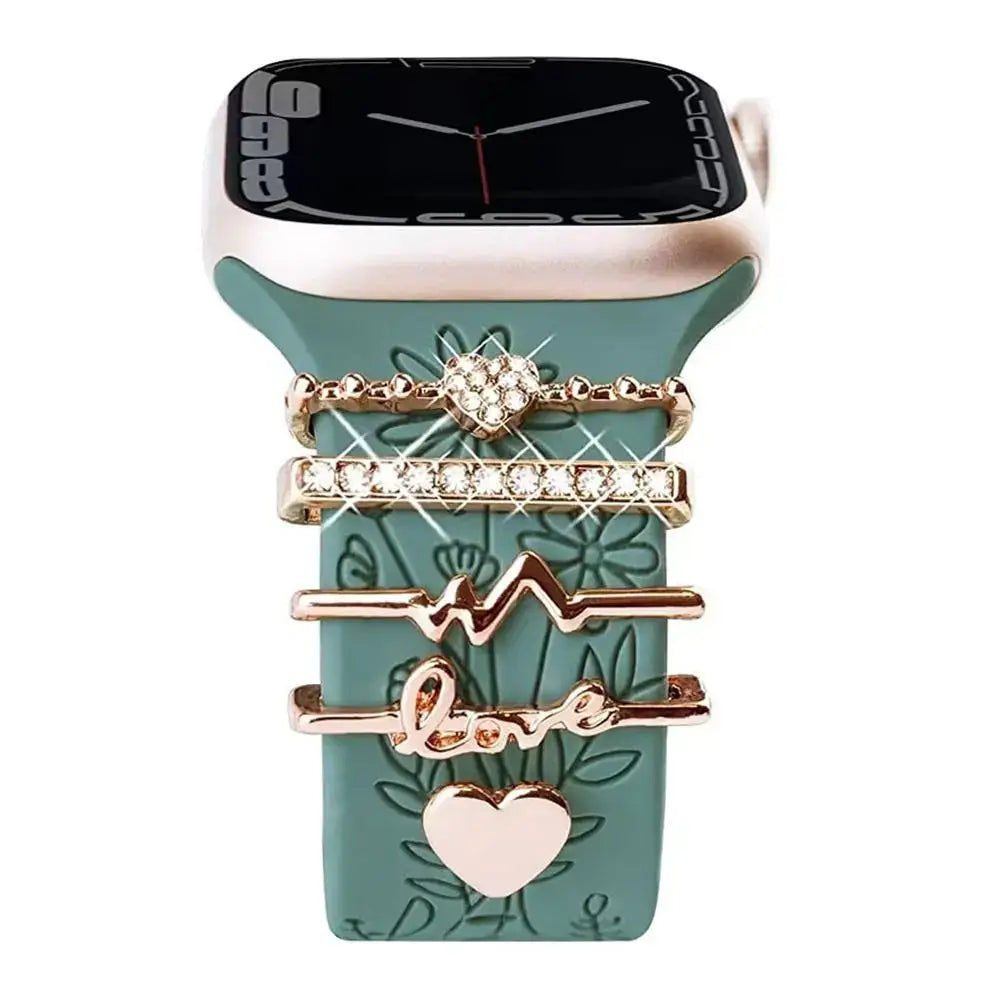 Decorative metal charms for Apple Watch bands, showcasing elegance and stylish craftsmanship on a green strap.
