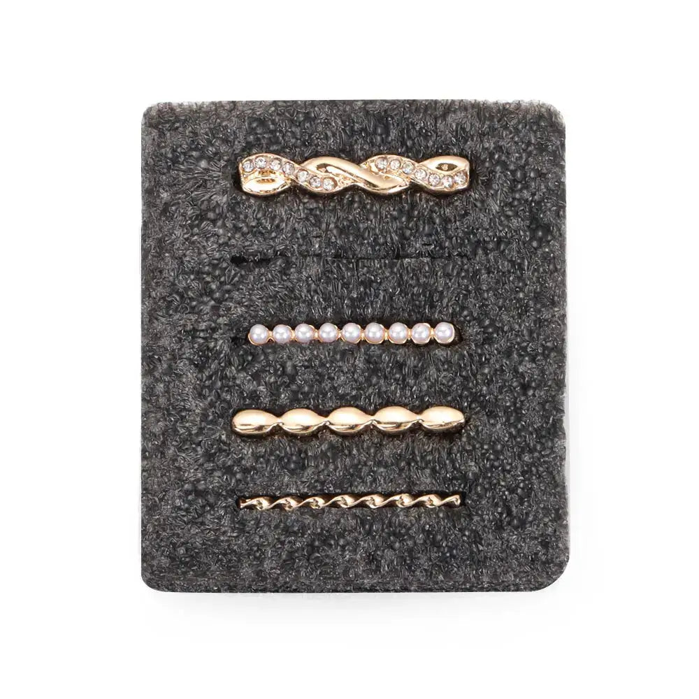 Decorative metal charms for Apple Watch bands featuring gold, pearl, and twisted designs on a gray background.