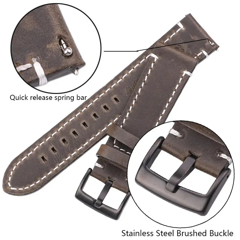 Close-up of leather Suunto watch band with quick release spring bar and stainless steel brushed buckle for durability.
