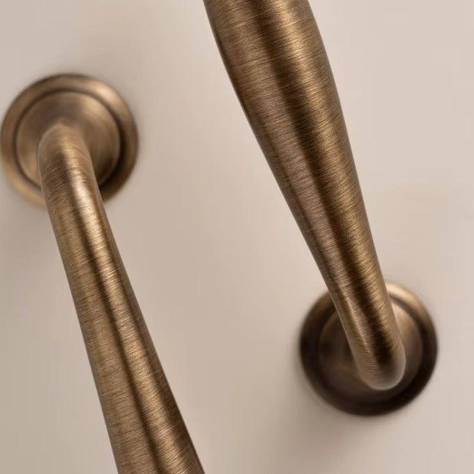 Arched solid brass cabinet pull in antique brass