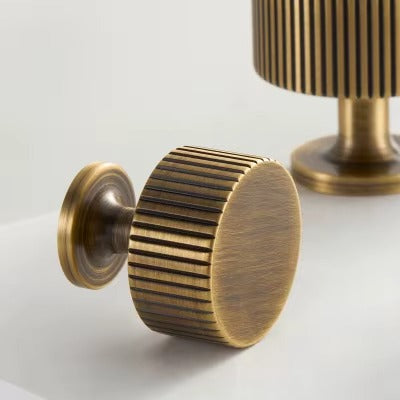Fluted solid brass round cabinet knob in antique brass