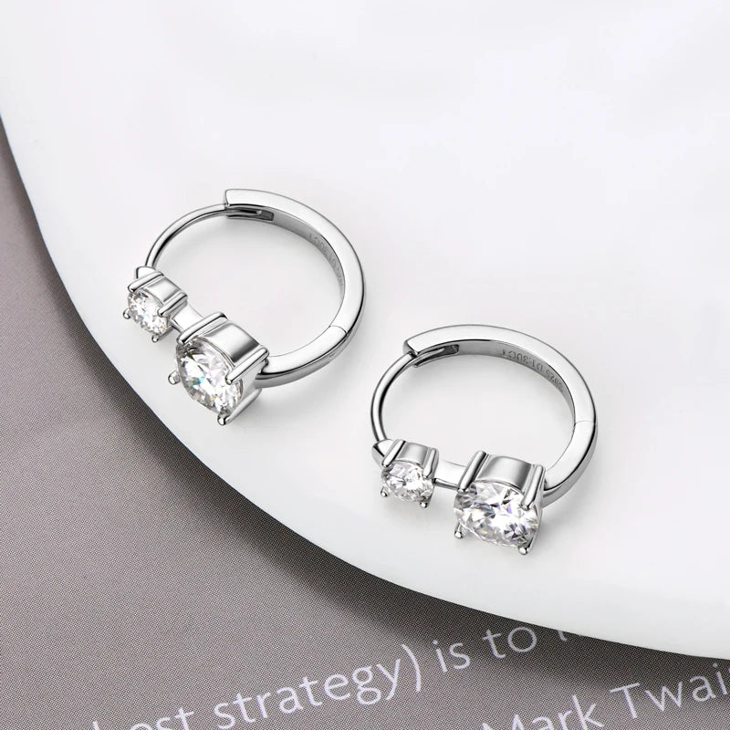 Graduated Two-Stone Moissanite Hoop Earrings in Sterling Silver — Silver hoops laid flat