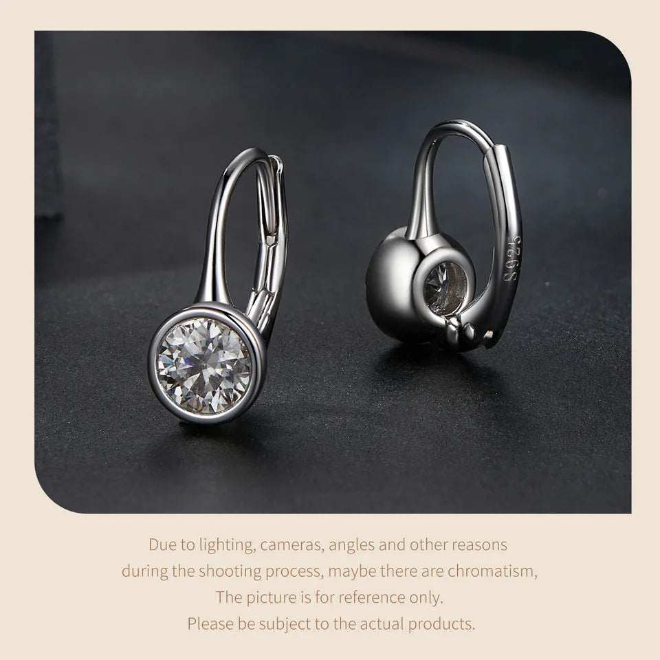 Round Bezel Moissanite Leverback Earrings in Silver — Angled pair