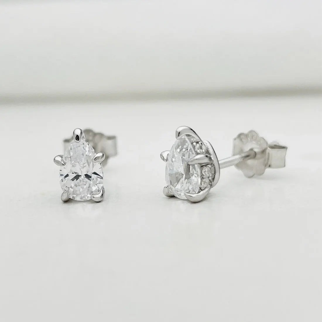 Pear Moissanite Stud Earrings in Sterling Silver — Small pear stud pair