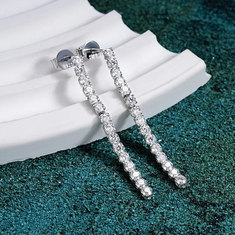 Moissanite Tennis Chain Drop Earrings in Sterling Silver — Silver drops on display