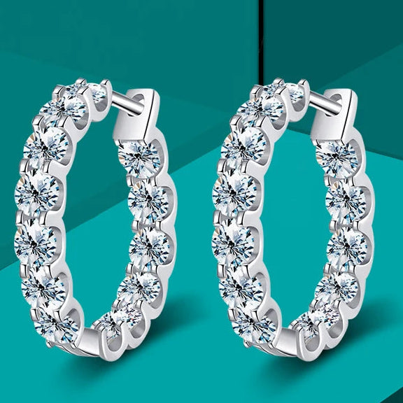Round Moissanite Hoop Earrings in White Gold-Plated Silver — Hoop pair on turquoise