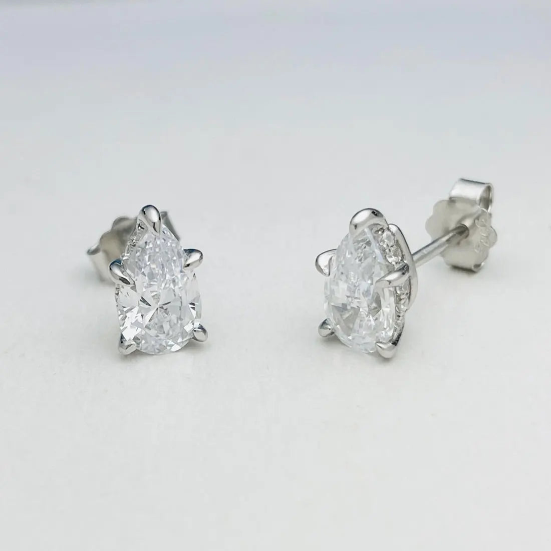 Pear Moissanite Stud Earrings in Sterling Silver — Medium pear stud pair