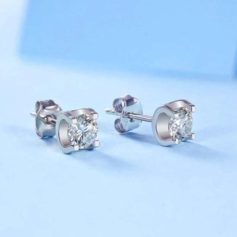 Colored Moissanite Necklace & Stud Earring Set in Silver — White studs on blue surface