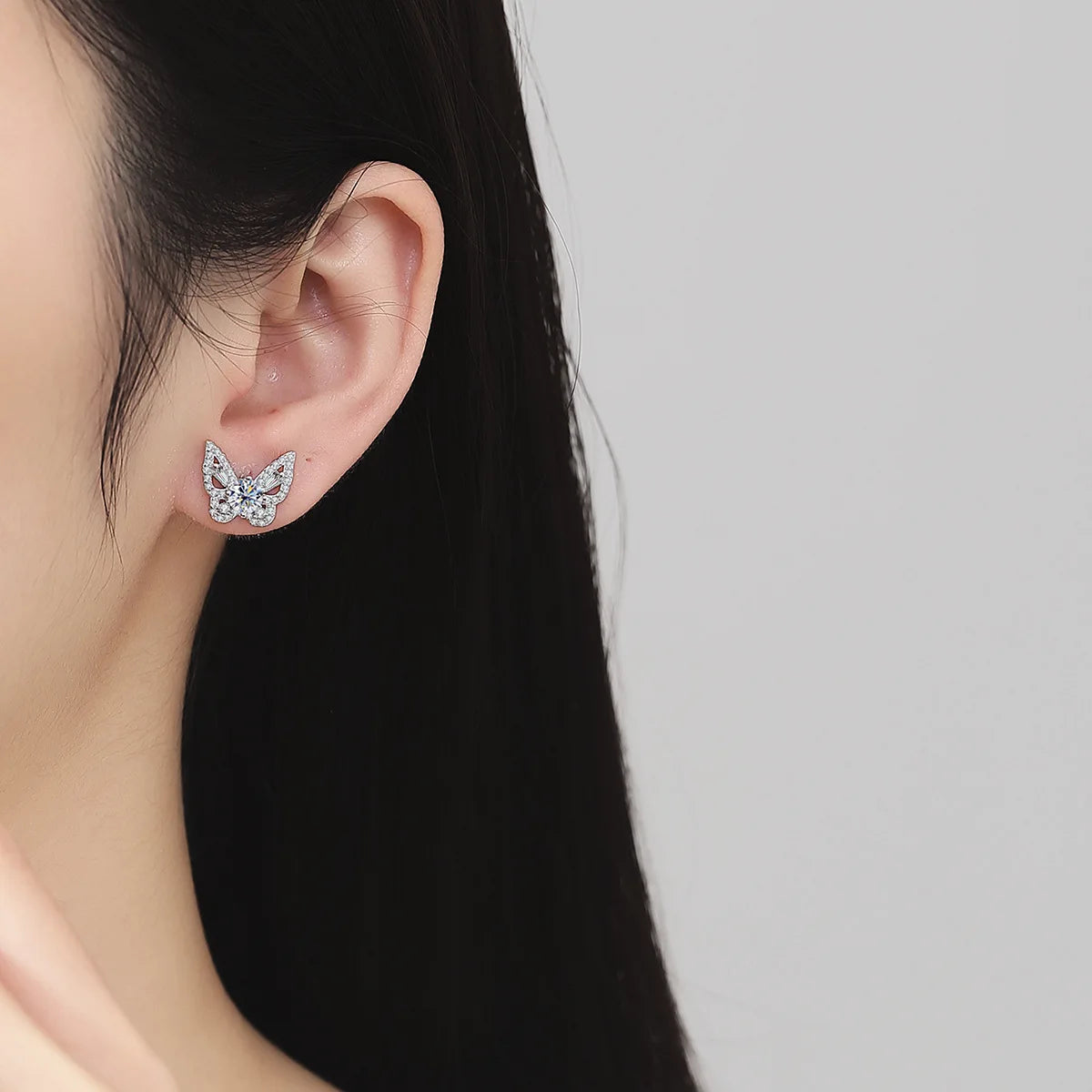 Butterfly Moissanite Stud Earrings in Sterling Silver — Worn on ear