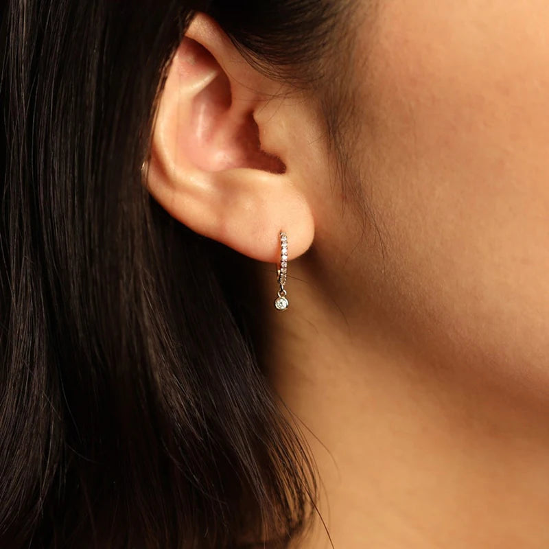 Bezel Drop Moissanite Huggie Earrings in Sterling Silver — Bezel-drop hoop worn on the ear