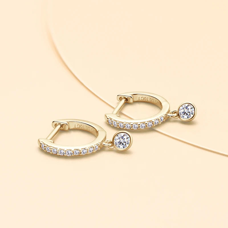 Bezel Drop Moissanite Huggie Earrings in Sterling Silver — Gold-Tone pair laid flat