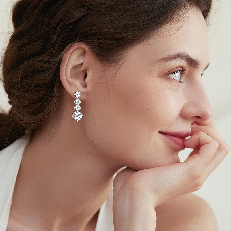Moissanite Four-Stone Drop Earrings in Sterling Silver — Four-stone earrings on ear — BandsCo Straps