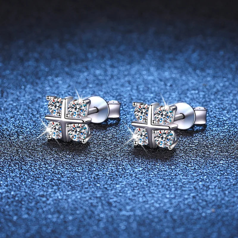 Four-Stone Cross Moissanite Stud Earrings in Silver — Cluster studs on blue surface