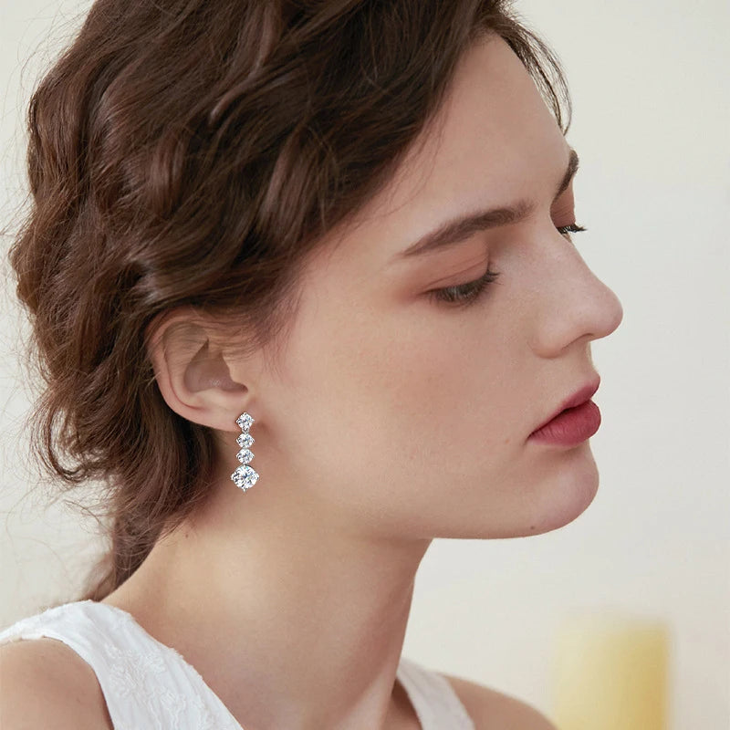 Moissanite Four-Stone Drop Earrings in Sterling Silver — Drop earrings worn on ear — BandsCo Straps