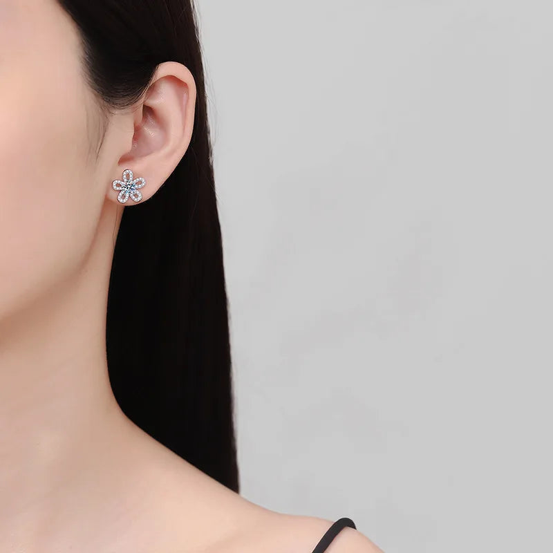 Five-Petal Flower Moissanite Stud Earrings in Silver — Worn on ear