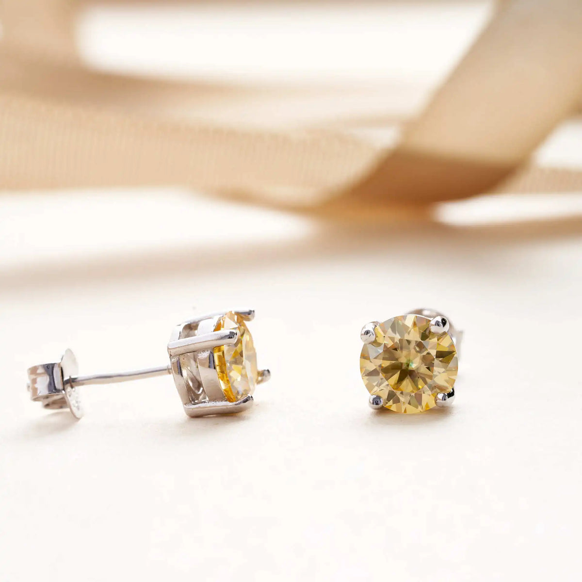 Lemon Yellow Moissanite Stud Earrings in Sterling Silver — Front and side views