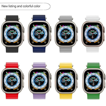 Colorful collection of Apple Watch with silicone straps in red, blue, grey, purple, yellow, and green.