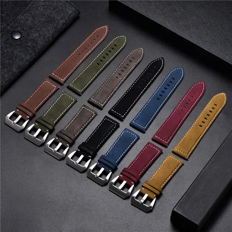 Variety of leather Suunto watch bands in different colors displayed on a dark background. Durable and stylish options for everyday wear.