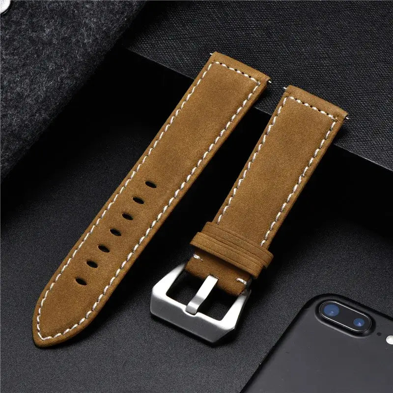 High-quality leather Suunto watch band in brown with a silver buckle, designed for durability and style.