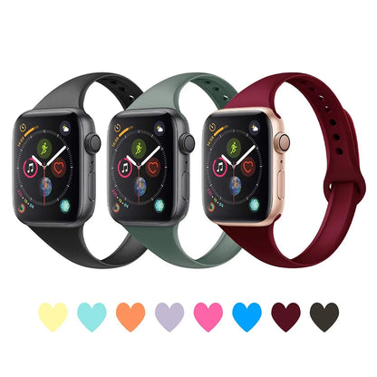 Apple Watch with silicone bands in black, green, and burgundy, showcasing versatility and comfort in various colors.