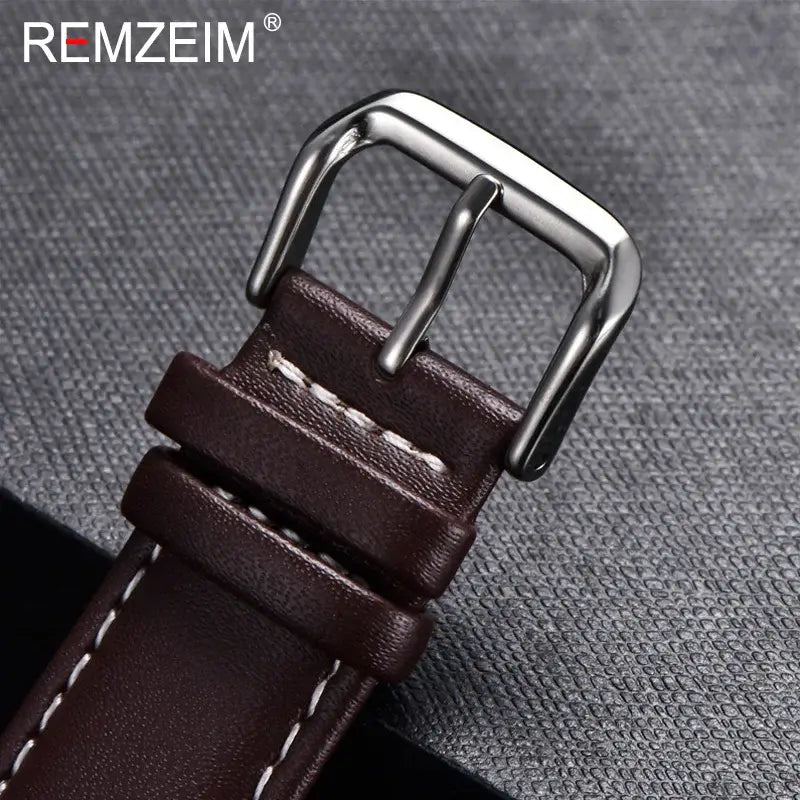 Brown leather strap buckle and keeper detail