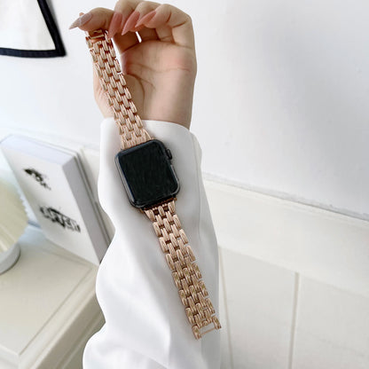 Elegant Apple Watch with luxury diamond design stainless steel band on wrist, perfect for any occasion.