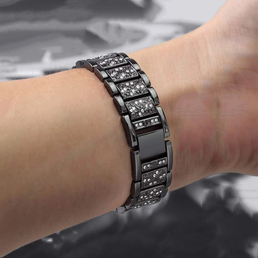 Stylish metal band with rhinestones for Fitbit Charge series worn on wrist, perfect accessory for smartwatches.